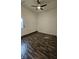 Small room with wood-look floors, ceiling fan, and natural light from an exterior door at 5760 Old Carriage Dr, Atlanta, GA 30349