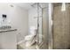 This bathroom features a glass shower door, tiled floors, and a granite topped vanity at , Decatur, GA 30035