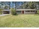 Charming one-story home with a red front door and a well-maintained lawn at , Decatur, GA 30035