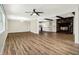 Spacious living room with wood floors, stone fireplace, and an open kitchen at , Decatur, GA 30035