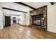 Open-concept living room featuring a stone fireplace and modern kitchen at , Decatur, GA 30035
