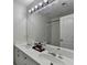 Bathroom features a double sink vanity with a large mirror and modern lighting at 1213 Harris Commons Place, Roswell, GA 30076