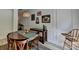 Bright dining area features a round table, decorative wall paneling, and stylish accents at 1213 Harris Commons Place, Roswell, GA 30076