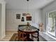 Dining area with wood table, wainscoting, and natural lighting at 1213 Harris Commons Place, Roswell, GA 30076