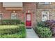 Townhome front door with a red door, nice landscape and walkway at 1213 Harris Commons Place, Roswell, GA 30076
