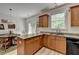 Modern kitchen with stainless appliances, granite counters, and a breakfast nook at 1213 Harris Commons Place, Roswell, GA 30076