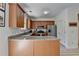 Kitchen featuring granite countertops, wooden cabinets, and stainless appliances at 1213 Harris Commons Place, Roswell, GA 30076