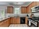 Modern kitchen with granite countertops, updated appliances, and natural light at 1213 Harris Commons Place, Roswell, GA 30076