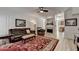 Spacious living room featuring a leather sofa, fireplace, and wood-look floors at 1213 Harris Commons Place, Roswell, GA 30076