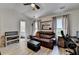 Inviting living room featuring a comfortable leather sofa and stylish decor at 1213 Harris Commons Place, Roswell, GA 30076