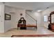 Foyer featuring hardwood-style flooring, a staircase, and a antique furniture at 1213 Harris Commons Place, Roswell, GA 30076