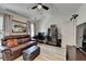 Bright living room boasts vaulted ceilings, a ceiling fan, and a well-lit workspace at 1213 Harris Commons Place, Roswell, GA 30076