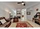 Open living room featuring hardwood-style flooring, fireplace, and view to the kitchen at 1213 Harris Commons Place, Roswell, GA 30076
