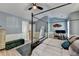 Spacious main bedroom with a four-poster bed, hardwood floors, and comfortable seating at 1213 Harris Commons Place, Roswell, GA 30076