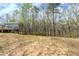 A large lot with mature trees located behind the house and the deck at 167 Fairview Oak Trl, Dallas, GA 30157