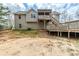 The backyard with a deck and stairs leading up to the house at 167 Fairview Oak Trl, Dallas, GA 30157