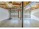 Unfinished basement with garage doors and exposed ceiling, offering potential for customization at 167 Fairview Oak Trl, Dallas, GA 30157