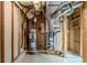 Exposed basement utilities including water heater and air conditioning unit at 167 Fairview Oak Trl, Dallas, GA 30157