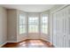 Bedroom with a bay window, hardwood floors, and a closet with paneled doors at 167 Fairview Oak Trl, Dallas, GA 30157