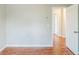 Bedroom features hardwood floors, neutral paint, and an open doorway at 167 Fairview Oak Trl, Dallas, GA 30157