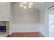 Dining area with laminate flooring and traditional lighting, adjacent to the living room at 167 Fairview Oak Trl, Dallas, GA 30157