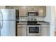 Kitchen featuring stainless steel appliances, and ample counter space at 167 Fairview Oak Trl, Dallas, GA 30157