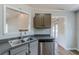 Kitchen with stainless steel dishwasher, double sink, and ample cabinet space at 167 Fairview Oak Trl, Dallas, GA 30157