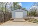 Outbuilding in backyard with large roll-up door at 167 Fairview Oak Trl, Dallas, GA 30157