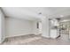 Open living room with light wood flooring and neutral paint, connecting seamlessly to the kitchen area at 2622 Terrace Pkwy, Morrow, GA 30260