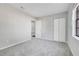 An inviting bedroom with soft gray carpeting, a closet, and a bright window at 2622 Terrace Pkwy, Morrow, GA 30260
