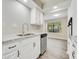 Updated kitchen with white cabinets, granite countertops, and stainless steel appliances at 2622 Terrace Pkwy, Morrow, GA 30260