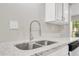 Close-up of kitchen sink featuring modern faucet and granite countertops at 2622 Terrace Pkwy, Morrow, GA 30260