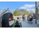 Expansive back deck boasts unique egg-shaped seating, grill, and scenic views at 3308 Pate Rd, Snellville, GA 30078