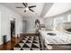 Bright bedroom with a black and white rug, modern decor, and hardwood floors at 3308 Pate Rd, Snellville, GA 30078