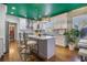 Modern kitchen with white cabinets, marble countertops, stainless steel appliances, and an island with bar seating at 3308 Pate Rd, Snellville, GA 30078