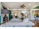 Inviting living room with a fireplace, hardwood floors, stylish furniture, and access to other living spaces at 3308 Pate Rd, Snellville, GA 30078