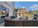 Cozy outdoor patio featuring comfortable seating, fireplace, and built-in grill at 3308 Pate Rd, Snellville, GA 30078