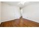 This bedroom features hardwood floors, a ceiling fan, and neutral paint at 4290 Chestnut Grove Ln, Austell, GA 30106