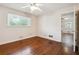 Bright bedroom with hardwood floors, ceiling fan, and window views at 4290 Chestnut Grove Ln, Austell, GA 30106