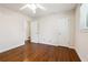 Bedroom with hardwood flooring, a ceiling fan, and access to other rooms at 4290 Chestnut Grove Ln, Austell, GA 30106