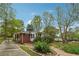 Charming ranch-style home with brick accents and mature trees at 4290 Chestnut Grove Ln, Austell, GA 30106