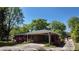 Charming single-story brick home featuring a covered carport and a well-manicured lawn, great curb appeal at 4290 Chestnut Grove Ln, Austell, GA 30106