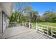 A spacious back deck provides outdoor lounging and views of the home's lush lawn at 5052 W Mountain St, Stone Mountain, GA 30083