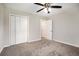 Bedroom with a ceiling fan and spacious closet at 5052 W Mountain St, Stone Mountain, GA 30083