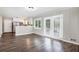 Open dining area with wood floors and doors to the backyard at 5052 W Mountain St, Stone Mountain, GA 30083