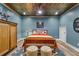 Comfortable bedroom featuring a copper colored ceiling and modern wood flooring at 963 Manor Parc Dr, Decatur, GA 30033