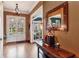Elegant foyer with hardwood floors, a decorative mirror, and an open view to the front yard at 963 Manor Parc Dr, Decatur, GA 30033