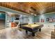 Spacious game room with a pool table, fireplace, and seating area at 963 Manor Parc Dr, Decatur, GA 30033