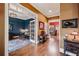 Inviting hallway leading to multiple rooms, showcasing hardwood floors and complementing the home's elegant layout and design at 963 Manor Parc Dr, Decatur, GA 30033
