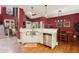 Bright kitchen with stainless steel appliances, granite counters, white cabinets, and hardwood floors at 963 Manor Parc Dr, Decatur, GA 30033